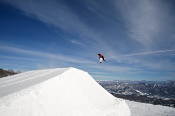 Naklejka na ściany i meble Extreme action snowboarder big air