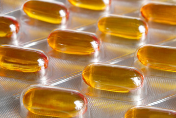 Yellow pills close-up