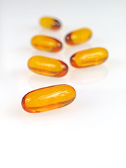 Yellow pills isolated on white