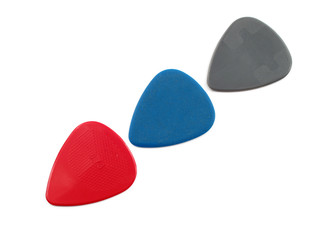 3 colour plectrums forming an arrow, isolated on white