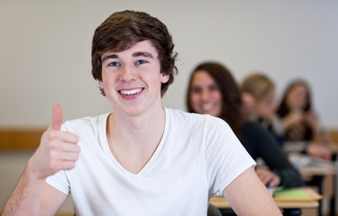 Happy Student has fun while working in classroom