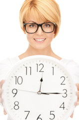 woman holding big clock