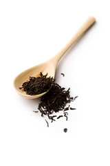 Tea and spoon isolated on white