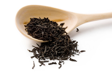 Tea and spoon isolated on white