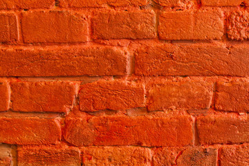 Red painted brick wall background.