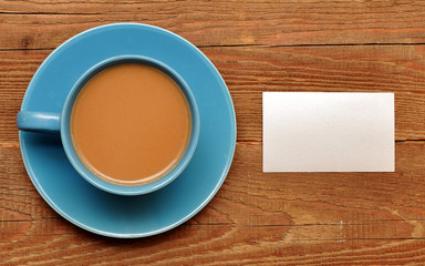blank card on coffee cup