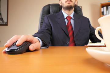 Businessman at office working at his workplace.