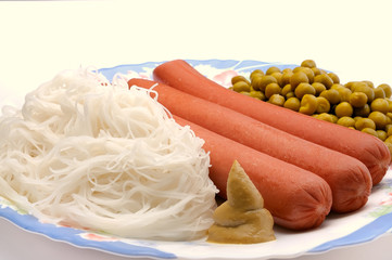 Dish with sausage, noodles and green peas