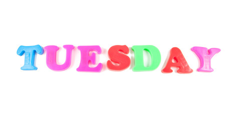 tuesday written in fridge magnets on white background