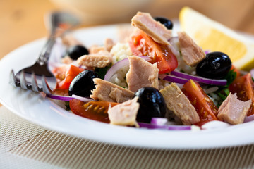 Tuna salad with rice and black olives