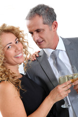 Couple celebrating new year's eve with champagne