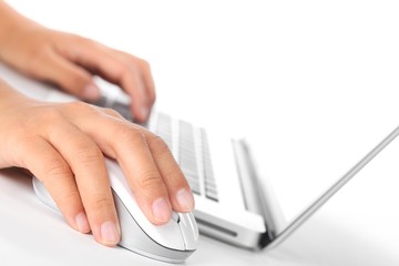 Closeup of fingers on computer mouse.