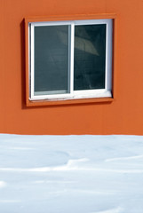 Orange house in the snow