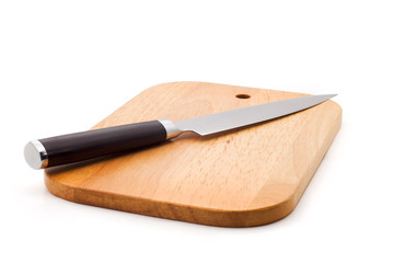 kitchen knife lying on a cutting board