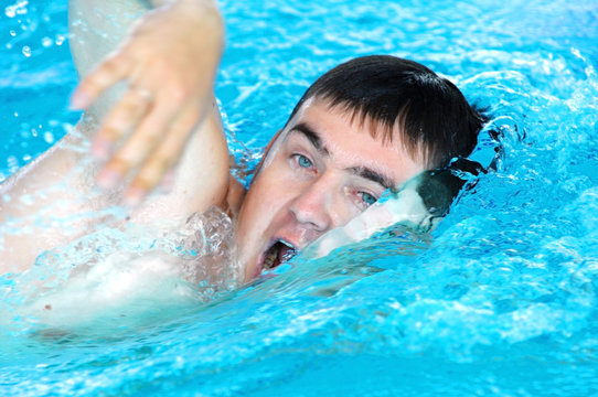 Swimmer swimming in the waterpool