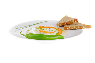 isolated salmon soup with bread and pepper