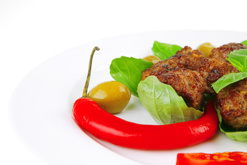 meat balls on basil leaf