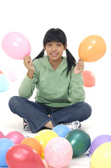 Fototapeta na wymiar Asian girl with balloon on white