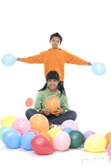 Fototapeta na wymiar Couple children with colorful balloons