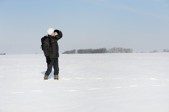 adult man in winter landscape