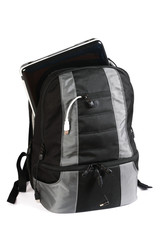 Backpack with a laptop inside isolated on white background