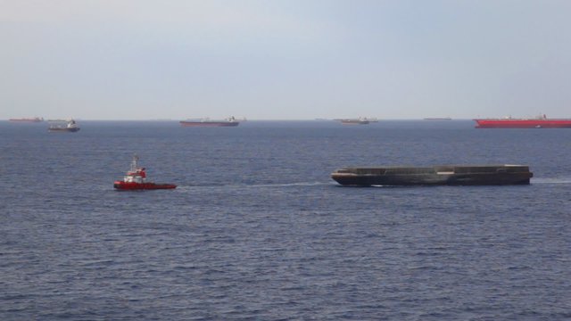 lot of freighter ships on seaway near moorage
