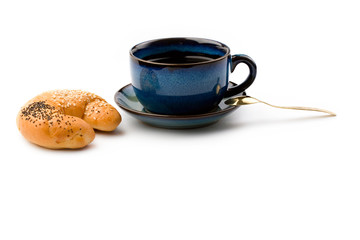 Mug and bun isolated on white
