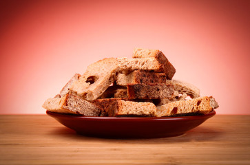 Rusk on red background
