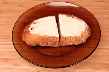 slices of buttered bread on a plate