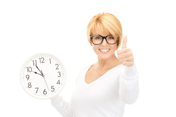 woman holding big clock