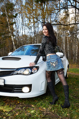 Brunette girl and stylish white car