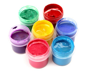 Colorful vibrant cans of gouache isolated on white