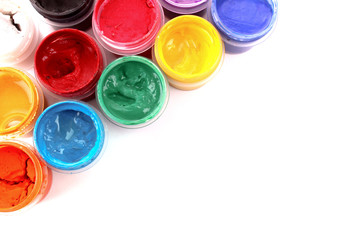 Colorful vibrant cans of gouache isolated on white