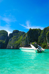 Fototapeta na wymiar Motor boat on turquoise water of Maya Bay lagoon, Phi Phi island
