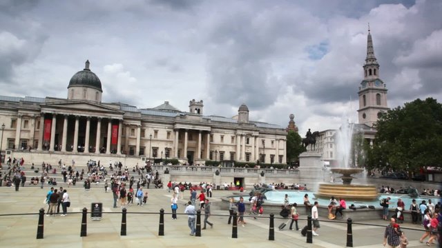 People walks on Trafalgar Square in London