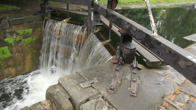 water flowing through sluice and falling