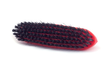 Red brush isolated on white background.