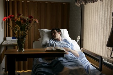 Man In A Hospital Bed