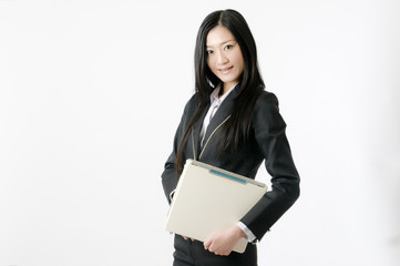 Obraz premium ノートPCを持つ女性社員