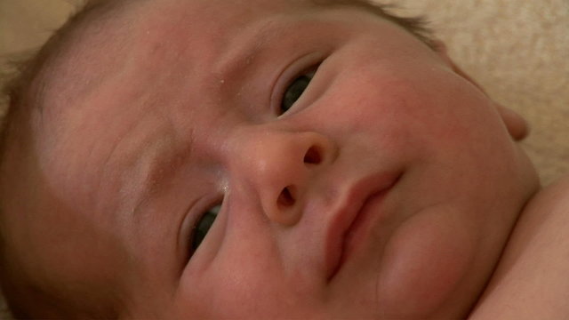 Close-up of crying newborn baby face