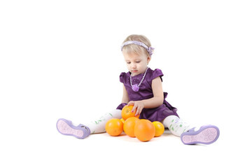 Fototapeta na wymiar Little girl with oranges