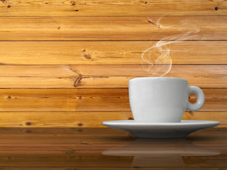 Fototapeta na wymiar A white cup of coffee on wood table