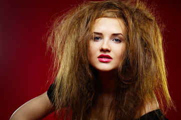 Fototapeta premium Portrait of the malicious girl with a mad hairdress
