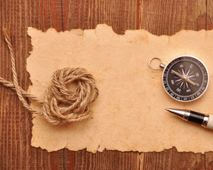 compass and rope on grunge background