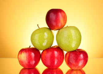 Apples on yellow background