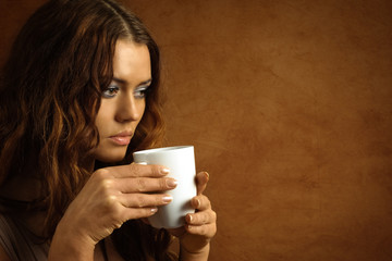 Woman with cup of hot drink