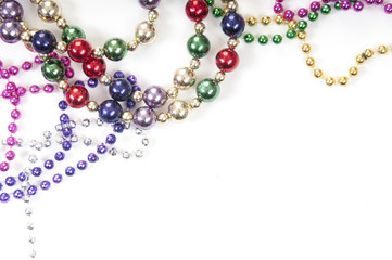 Mardi gras beads on white