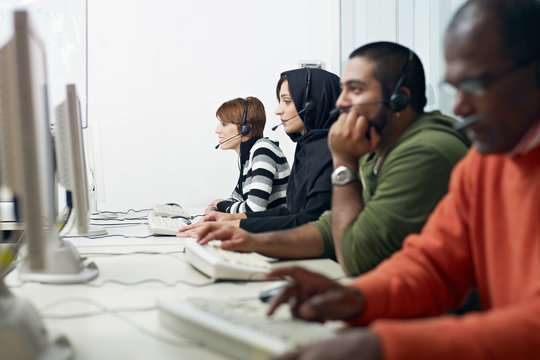 students with headset in computer lab - Powered by Adobe