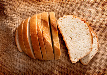 Pieces of bread on brown fabric