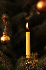 candle at christmas tree